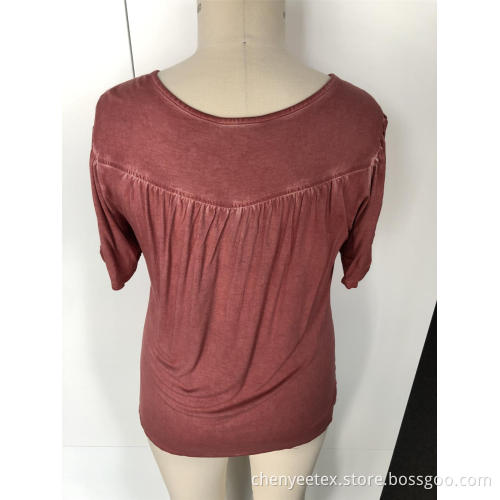 A short-sleeved blouse with tassel cut out